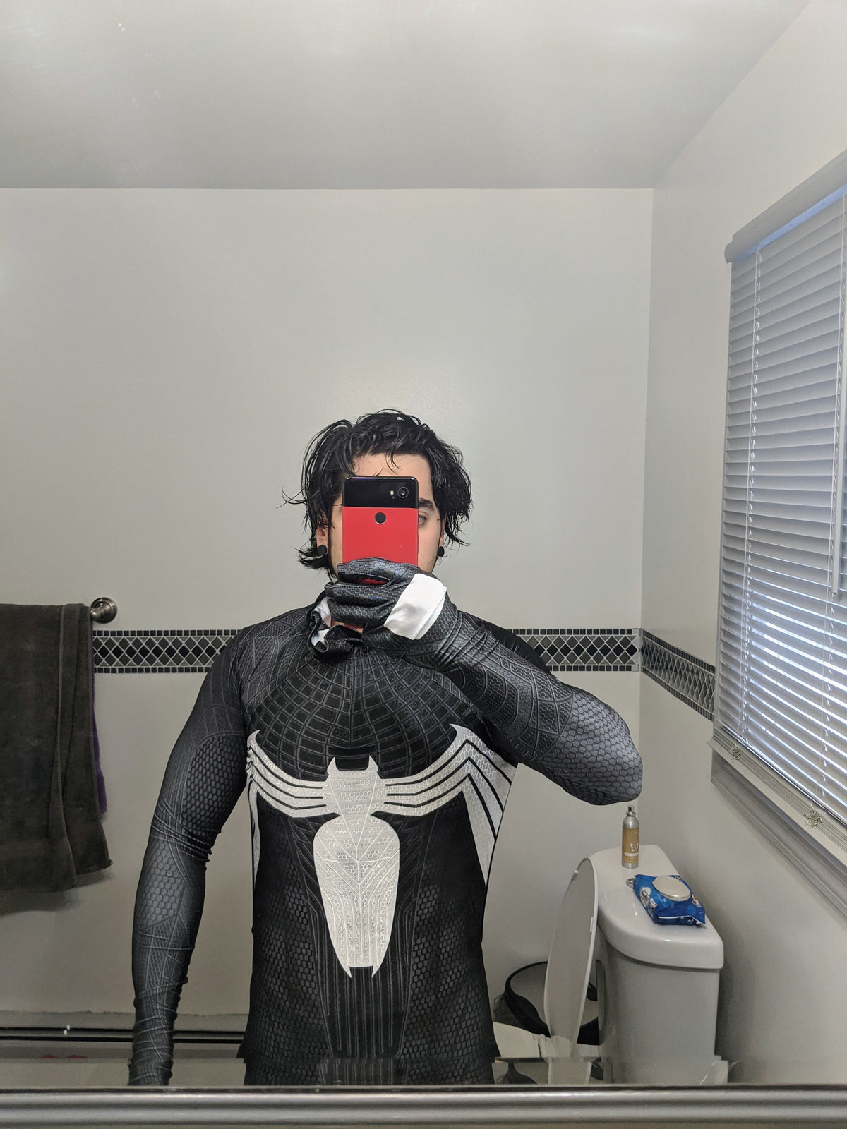 Person wearing a custom handmade Symbiote TASM Suit