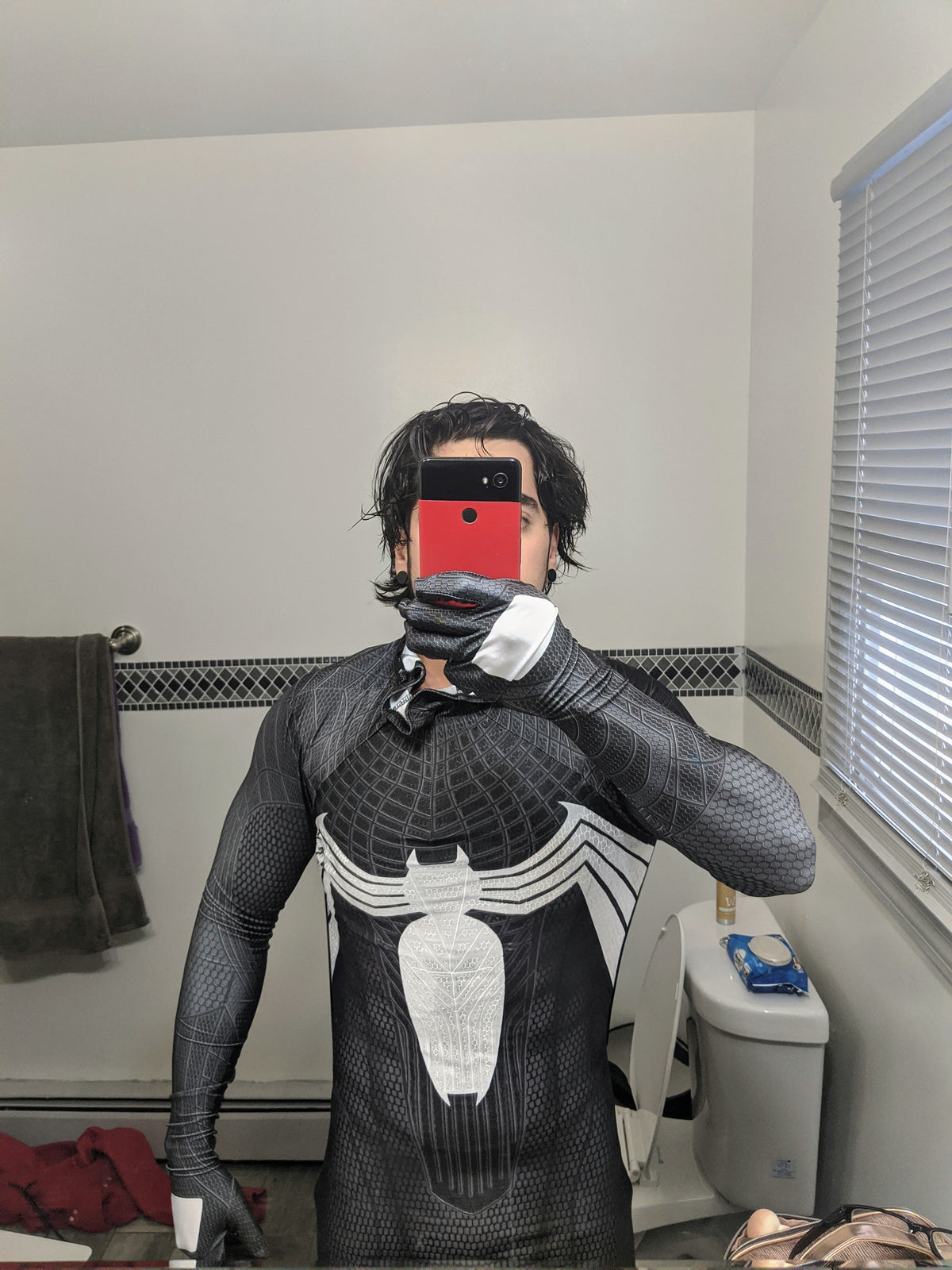 Person wearing a custom handmade Symbiote TASM Suit